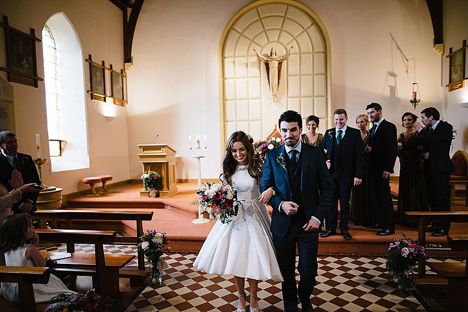 Karen wore a wedding dress with epaulettes for her Irish castle wedding in the Autumn. Photography by Epic Love.