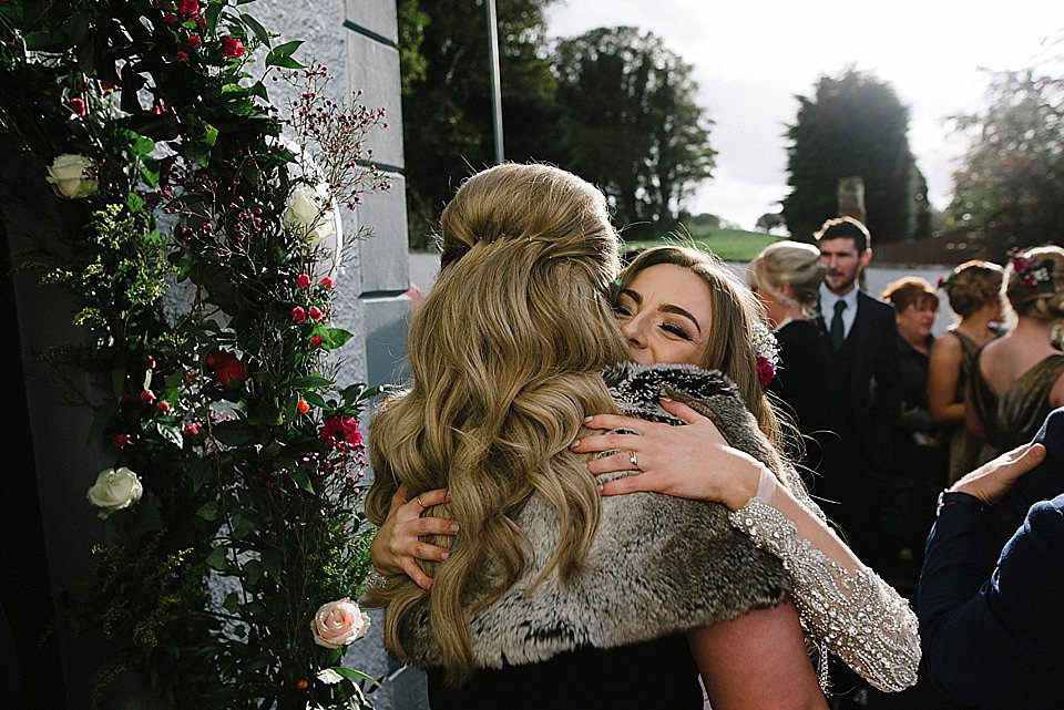 Karen wore a wedding dress with epaulettes for her Irish castle wedding in the Autumn. Photography by Epic Love.