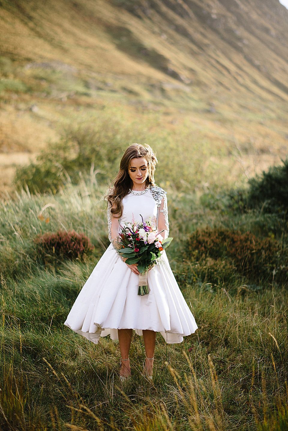 Karen wore a wedding dress with epaulettes for her Irish castle wedding in the Autumn. Photography by Epic Love.