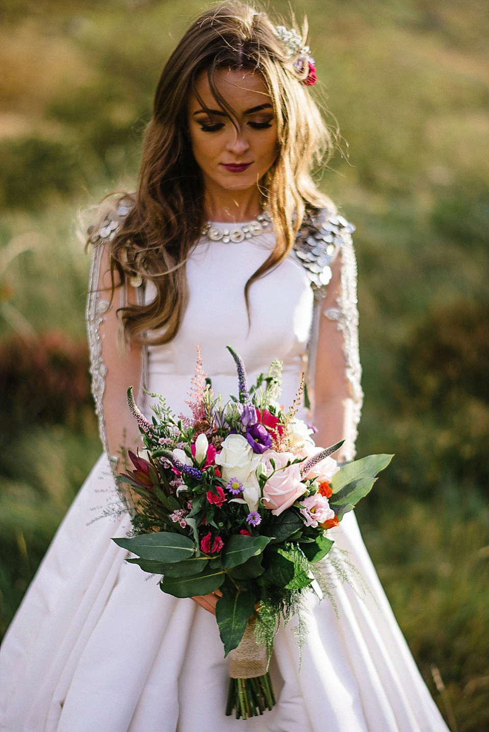 Karen wore a wedding dress with epaulettes for her Irish castle wedding in the Autumn. Photography by Epic Love.