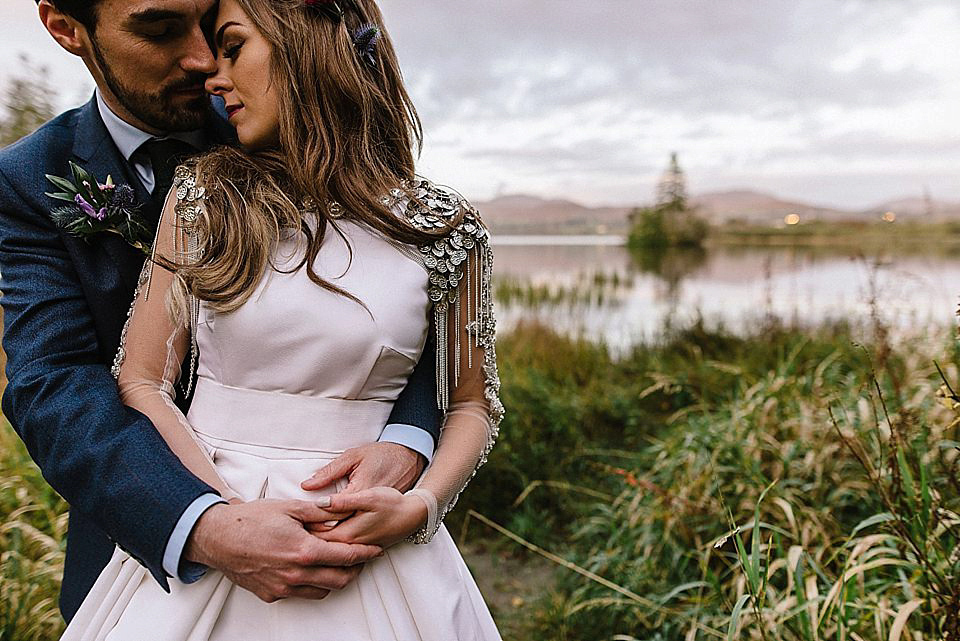 Karen wore a wedding dress with epaulettes for her Irish castle wedding in the Autumn. Photography by Epic Love.