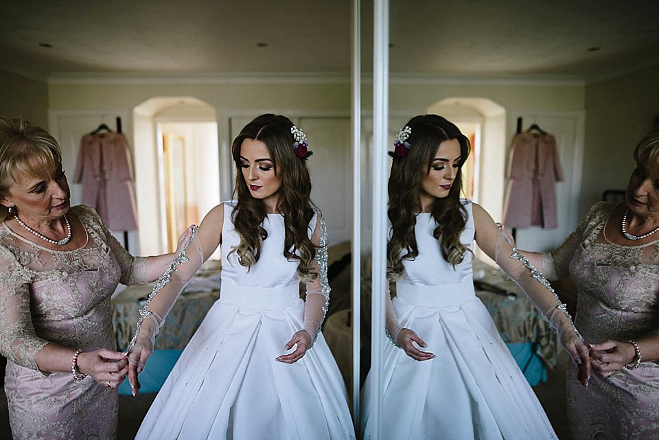 Karen wore a wedding dress with epaulettes for her Irish castle wedding in the Autumn. Photography by Epic Love.