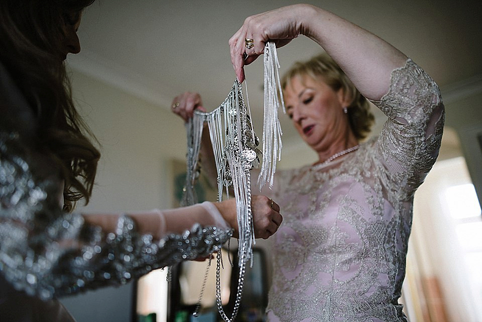 Karen wore a wedding dress with epaulettes for her Irish castle wedding in the Autumn. Photography by Epic Love.