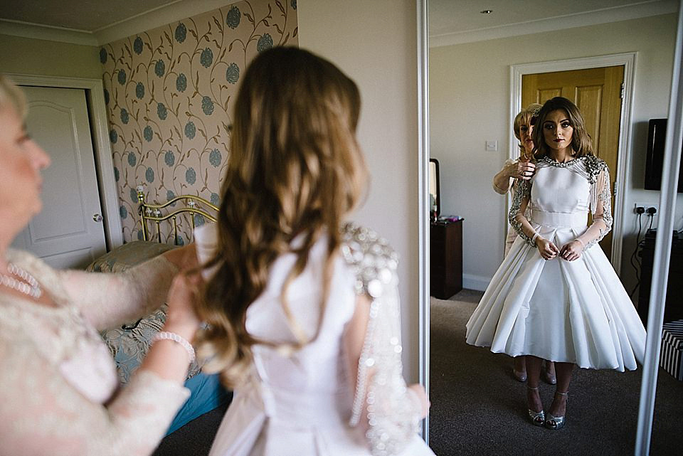 Karen wore a wedding dress with epaulettes for her Irish castle wedding in the Autumn. Photography by Epic Love.