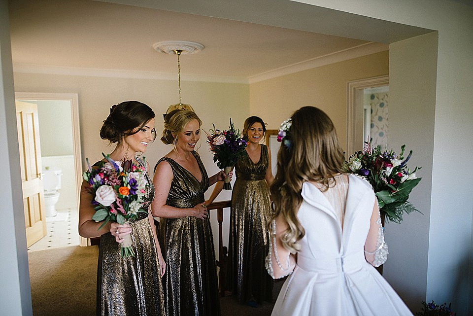 Karen wore a wedding dress with epaulettes for her Irish castle wedding in the Autumn. Photography by Epic Love.