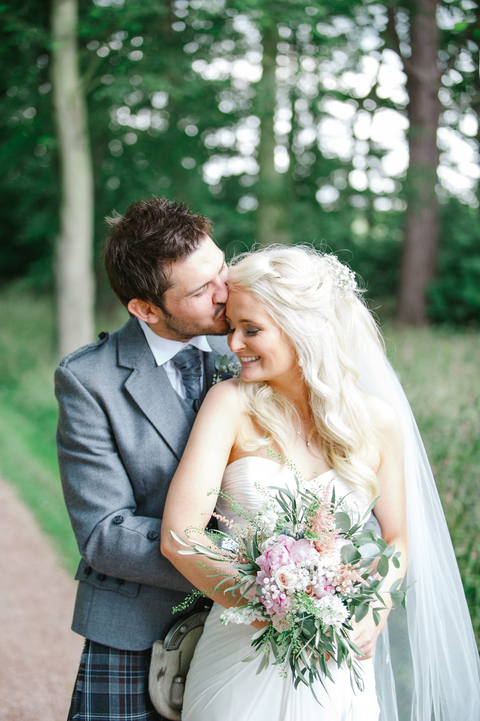 Mhairi wore an Enzoani gown for her rustic vintage inspired barn wedding in Scotland. Photography by The Gibsons.