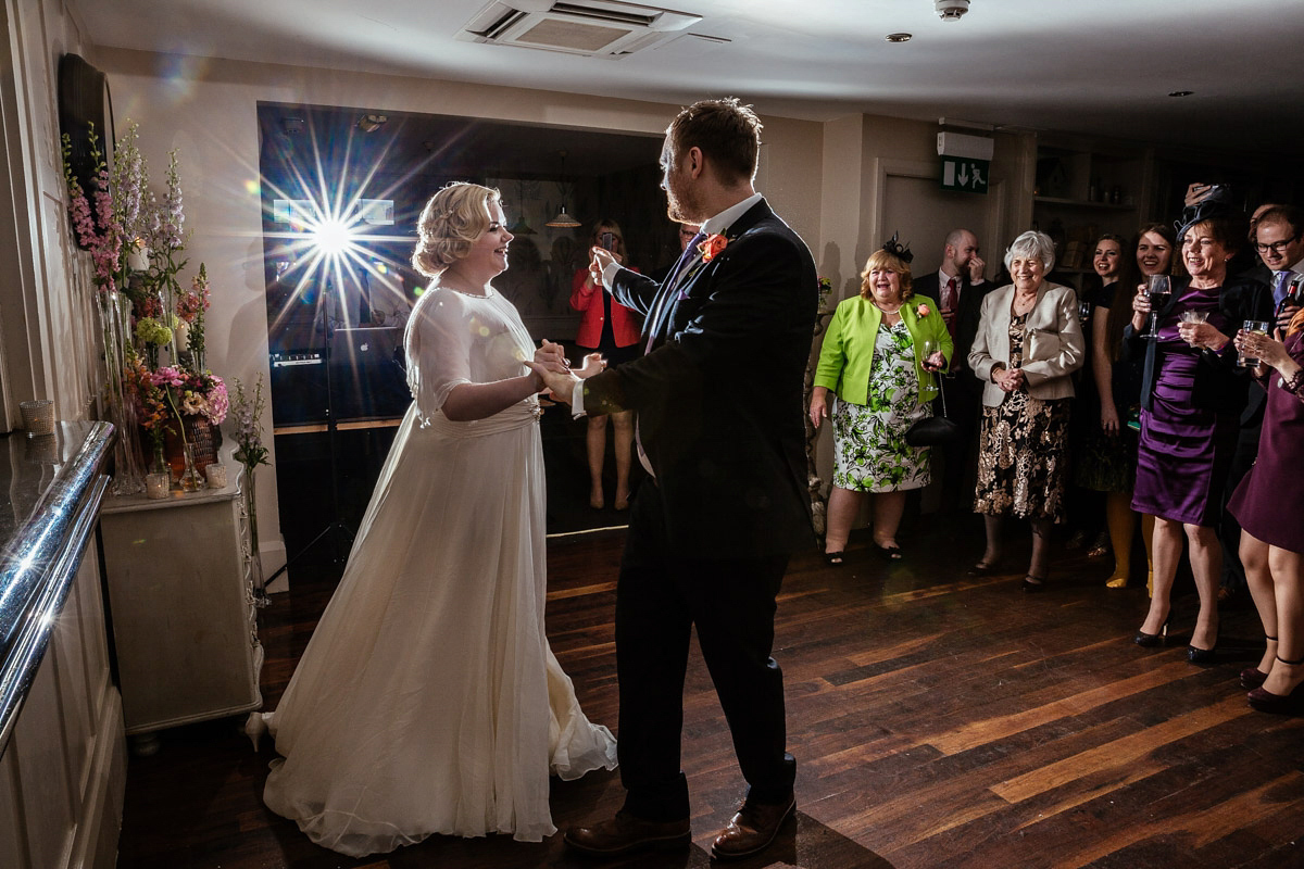 Daisy wears a Jenny Packham gown for her modern, stylish and colourful Manchester city wedding. Photography by Cassandra Lane.