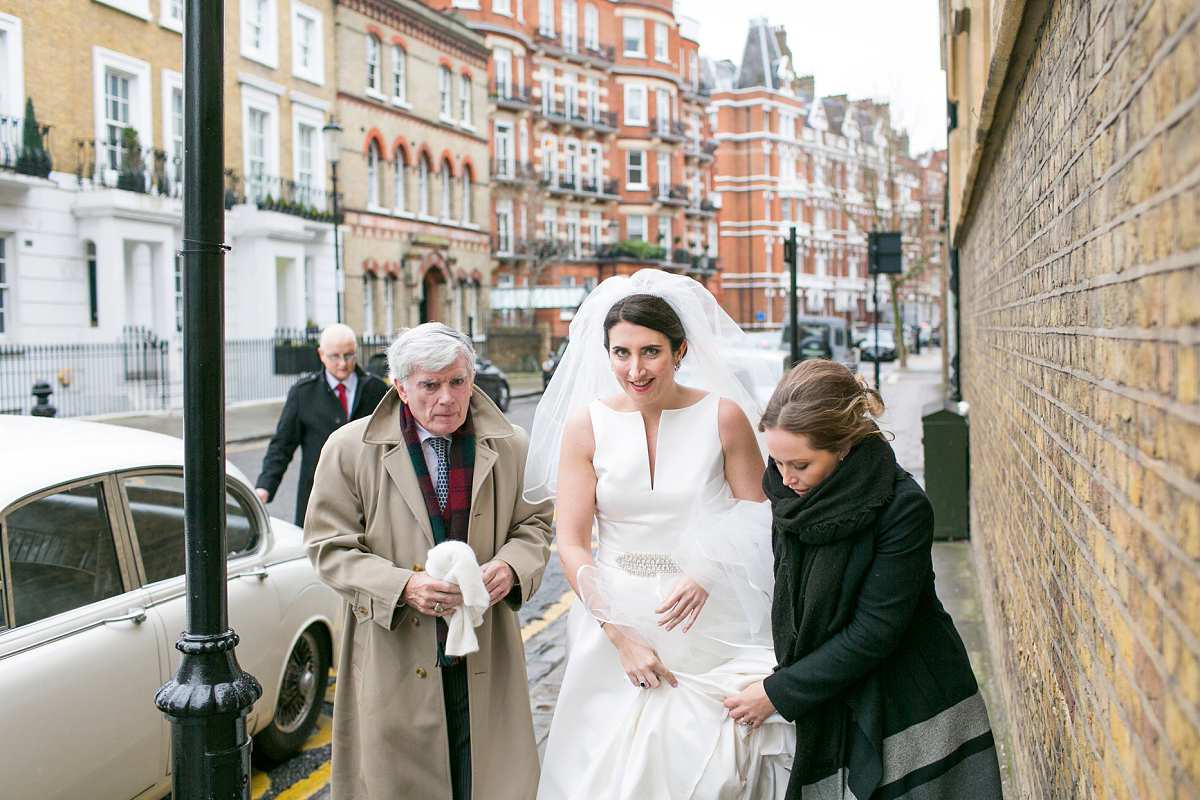 Jane wore a gown by Jesús Peiró for her chic and elegant winter wedding at the Corinthia Hotel in London. Photography by Anneli Marinovich.