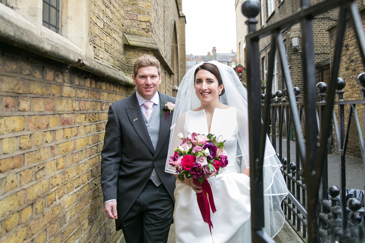 Jane wore a gown by Jesús Peiró for her chic and elegant winter wedding at the Corinthia Hotel in London. Photography by Anneli Marinovich.