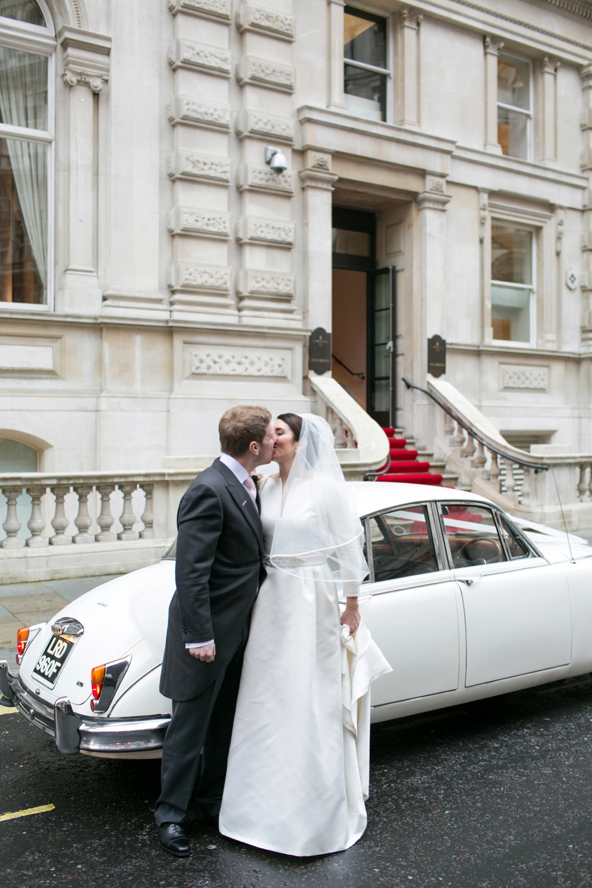 Jane wore a gown by Jesús Peiró for her chic and elegant winter wedding at the Corinthia Hotel in London. Photography by Anneli Marinovich.