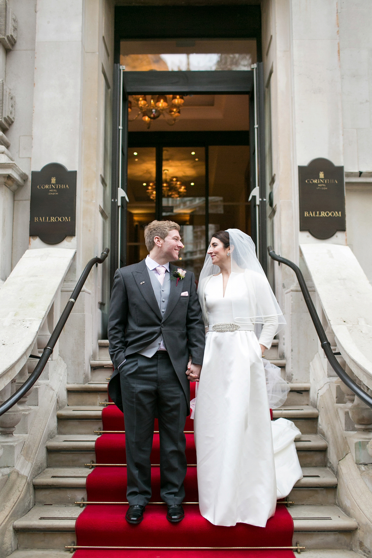 Jane wore a gown by Jesús Peiró for her chic and elegant winter wedding at the Corinthia Hotel in London. Photography by Anneli Marinovich.