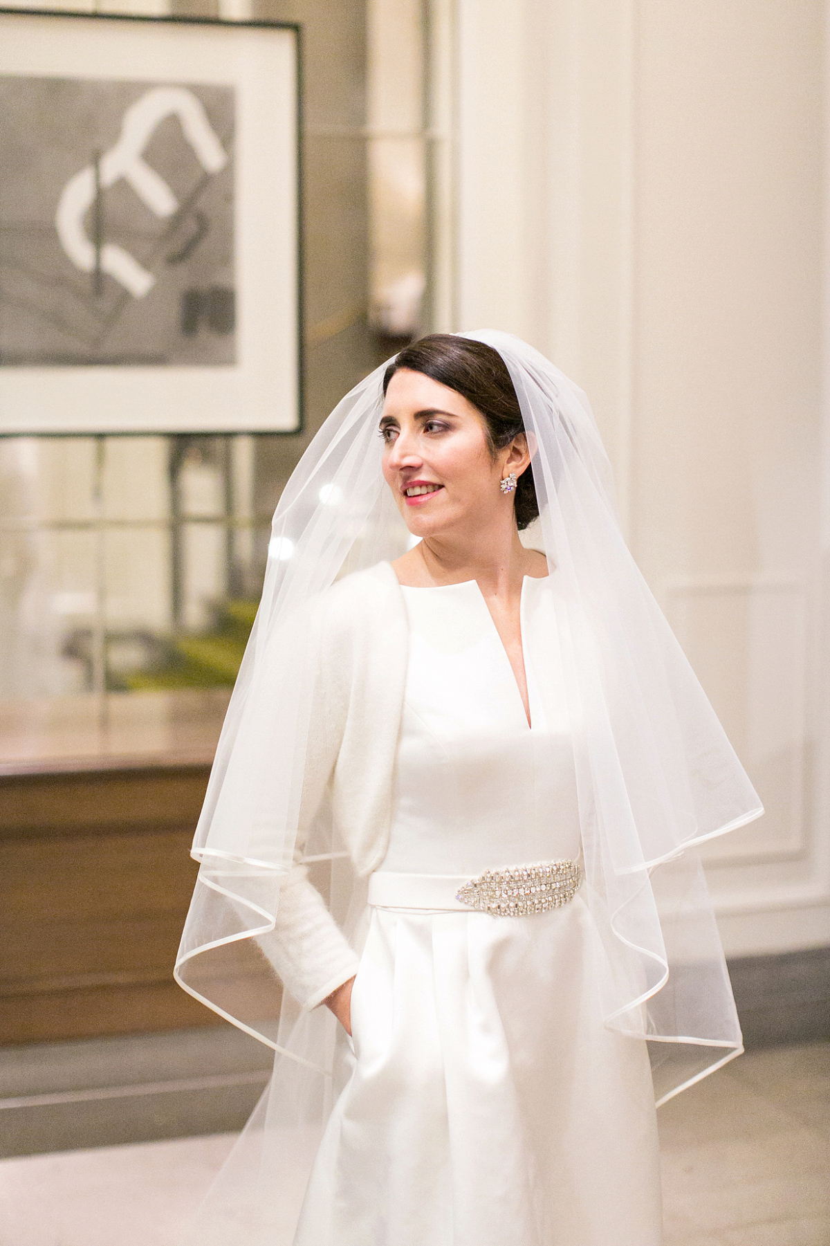 Jane wore a gown by Jesús Peiró for her chic and elegant winter wedding at the Corinthia Hotel in London. Photography by Anneli Marinovich.