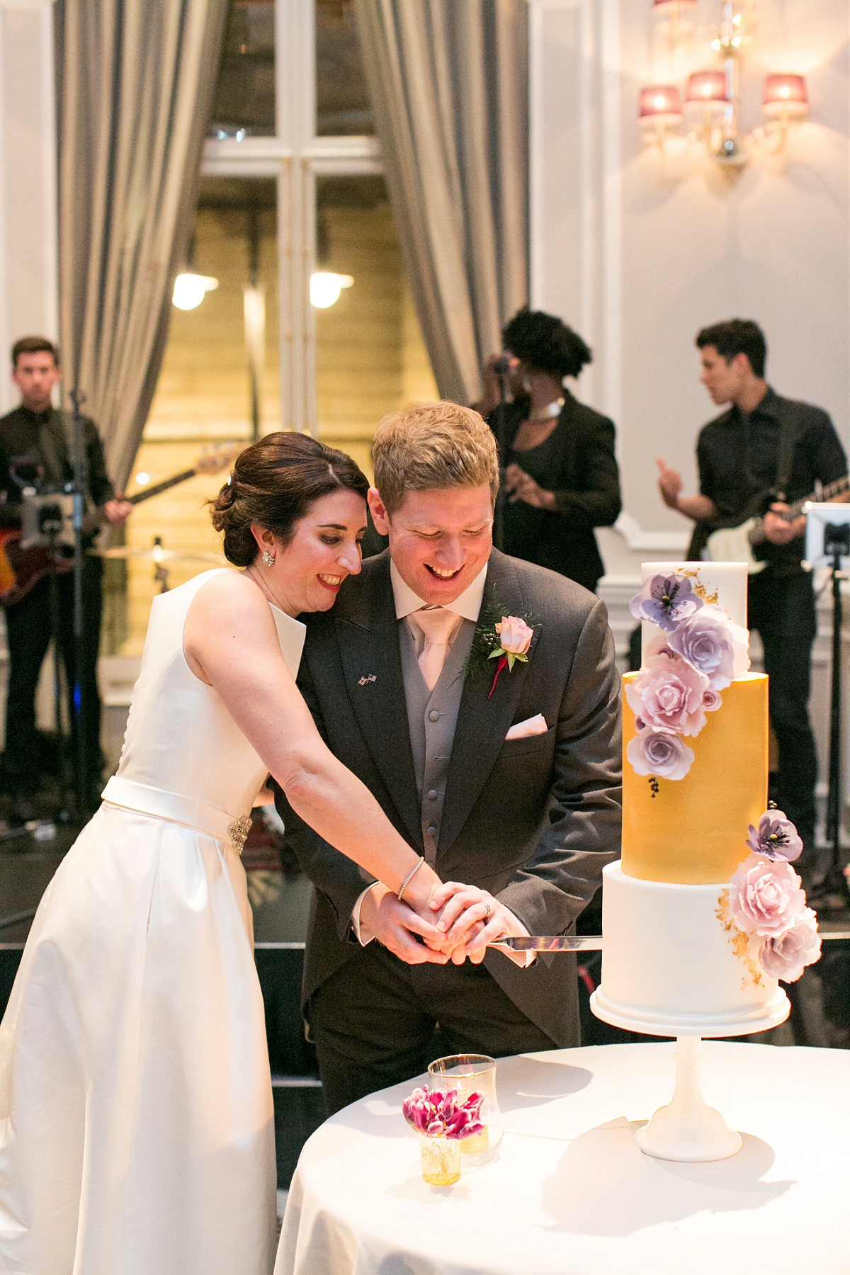 Jane wore a gown by Jesús Peiró for her chic and elegant winter wedding at the Corinthia Hotel in London. Photography by Anneli Marinovich.