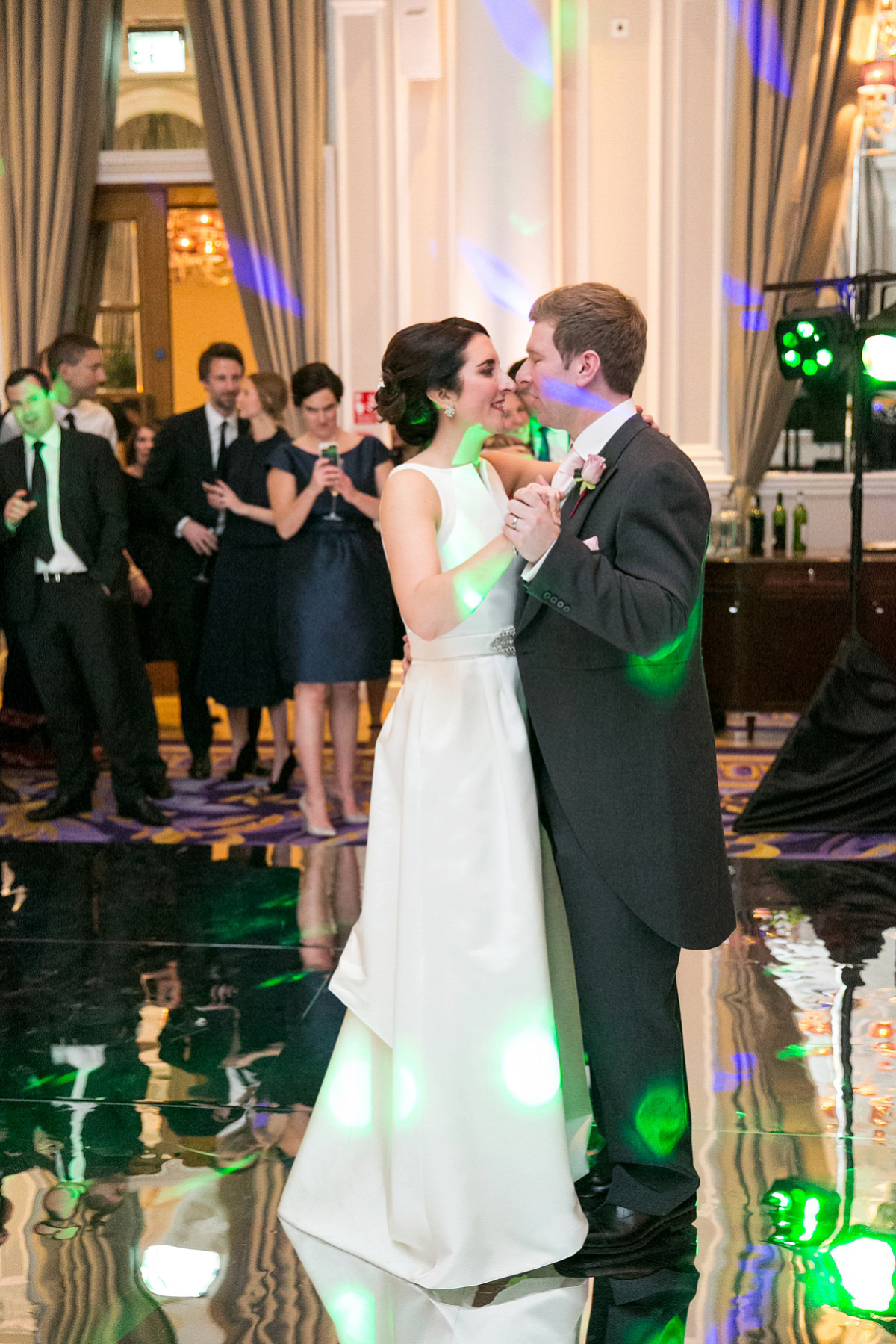 Jane wore a gown by Jesús Peiró for her chic and elegant winter wedding at the Corinthia Hotel in London. Photography by Anneli Marinovich.