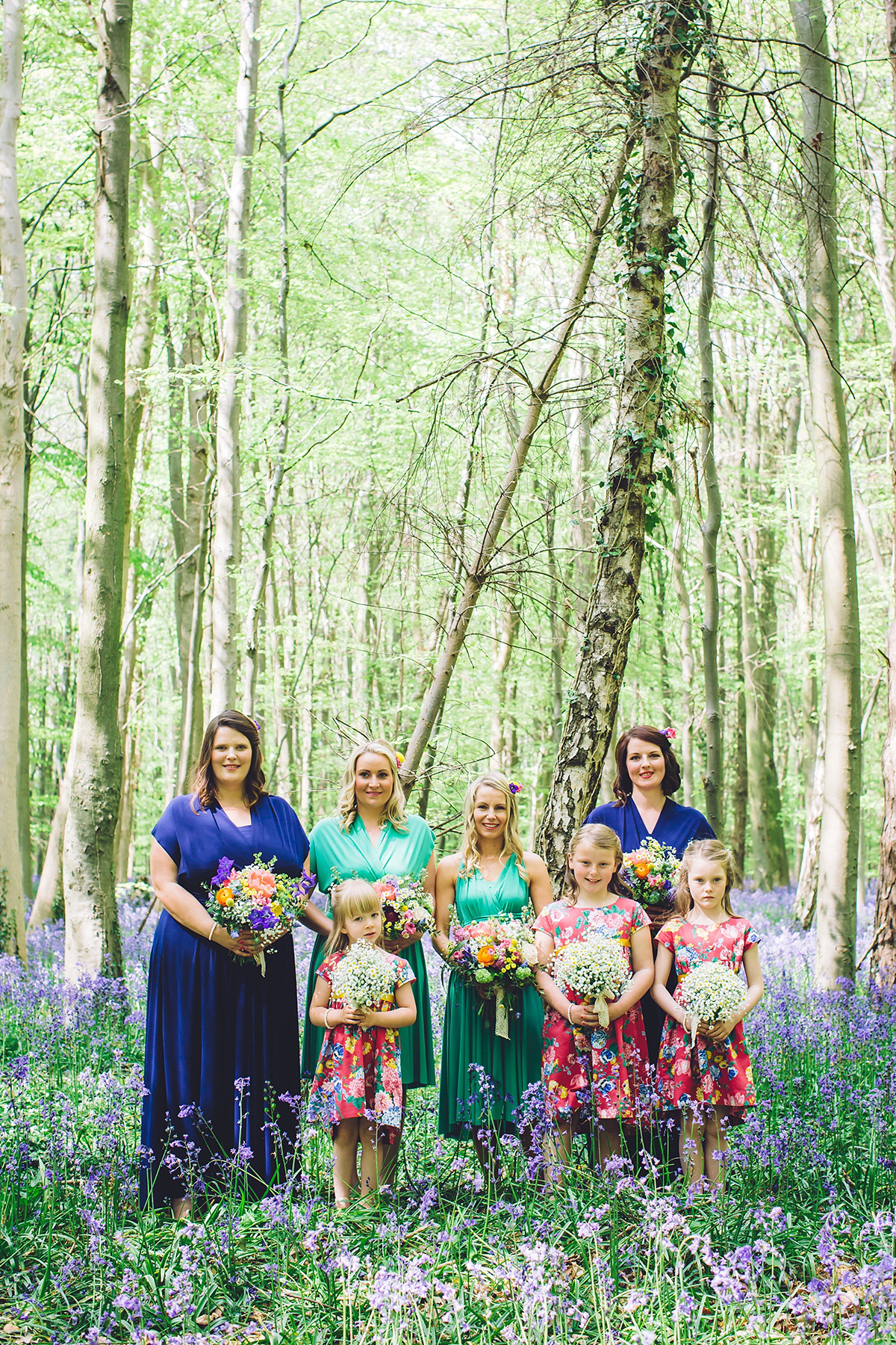 A bridal boutique owner's colourful, whimsical, bluebell filled woodland wedding. Photography by Olegs Samsonovs.