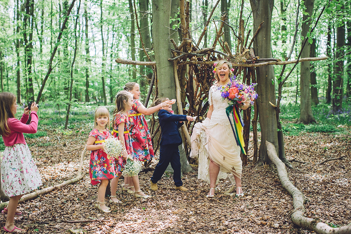 A bridal boutique owner's colourful, whimsical, bluebell filled woodland wedding. Photography by Olegs Samsonovs.