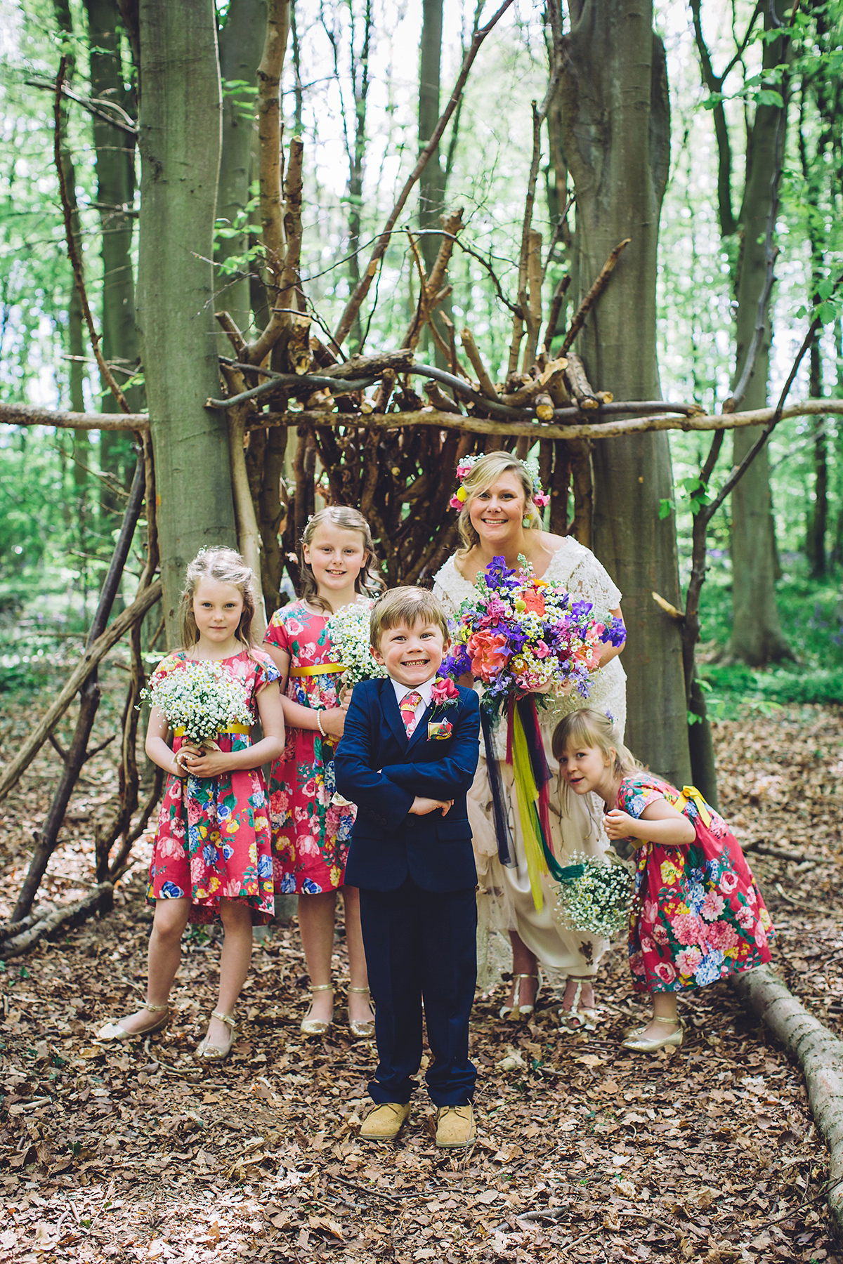 A bridal boutique owner's colourful, whimsical, bluebell filled woodland wedding. Photography by Olegs Samsonovs.