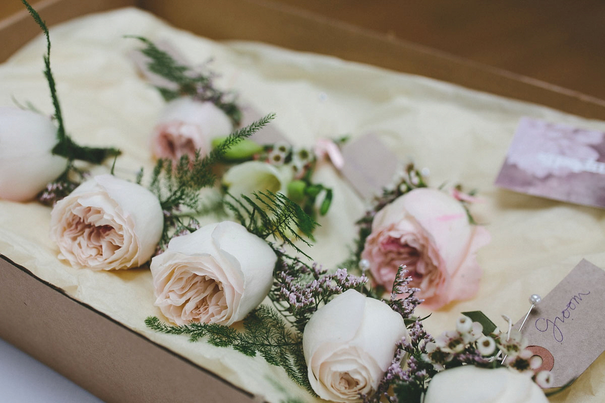 A floral wedding dress by Sassi Holford for a Summer wedding in the Peak District. Flowers by Campbell's Flowers, photography by Ellie Grace.