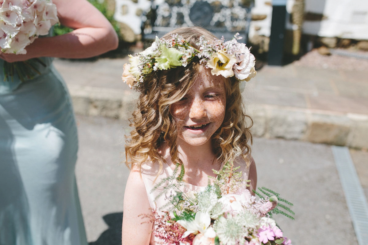 A floral wedding dress by Sassi Holford for a Summer wedding in the Peak District. Flowers by Campbell's Flowers, photography by Ellie Grace.