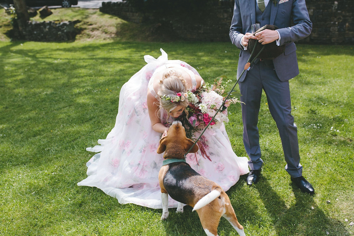 A floral wedding dress by Sassi Holford for a Summer wedding in the Peak District. Flowers by Campbell's Flowers, photography by Ellie Grace.