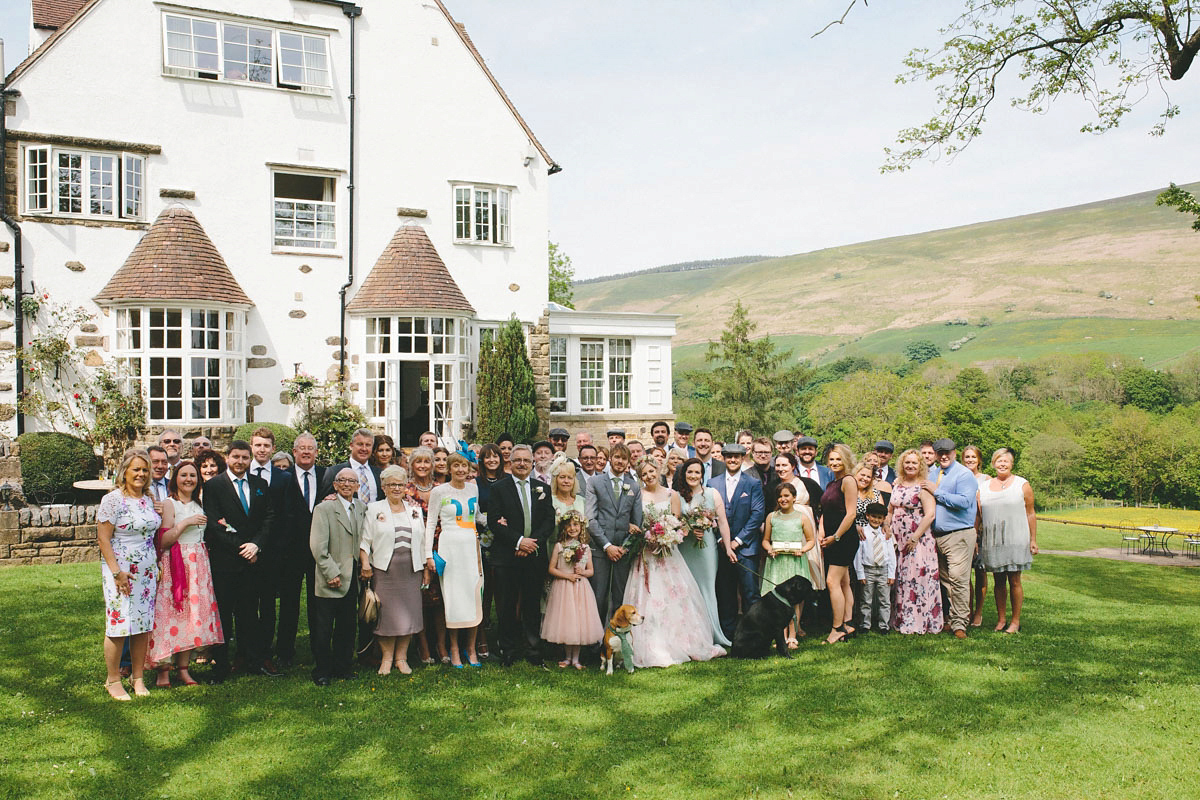 A floral wedding dress by Sassi Holford for a Summer wedding in the Peak District. Flowers by Campbell's Flowers, photography by Ellie Grace.