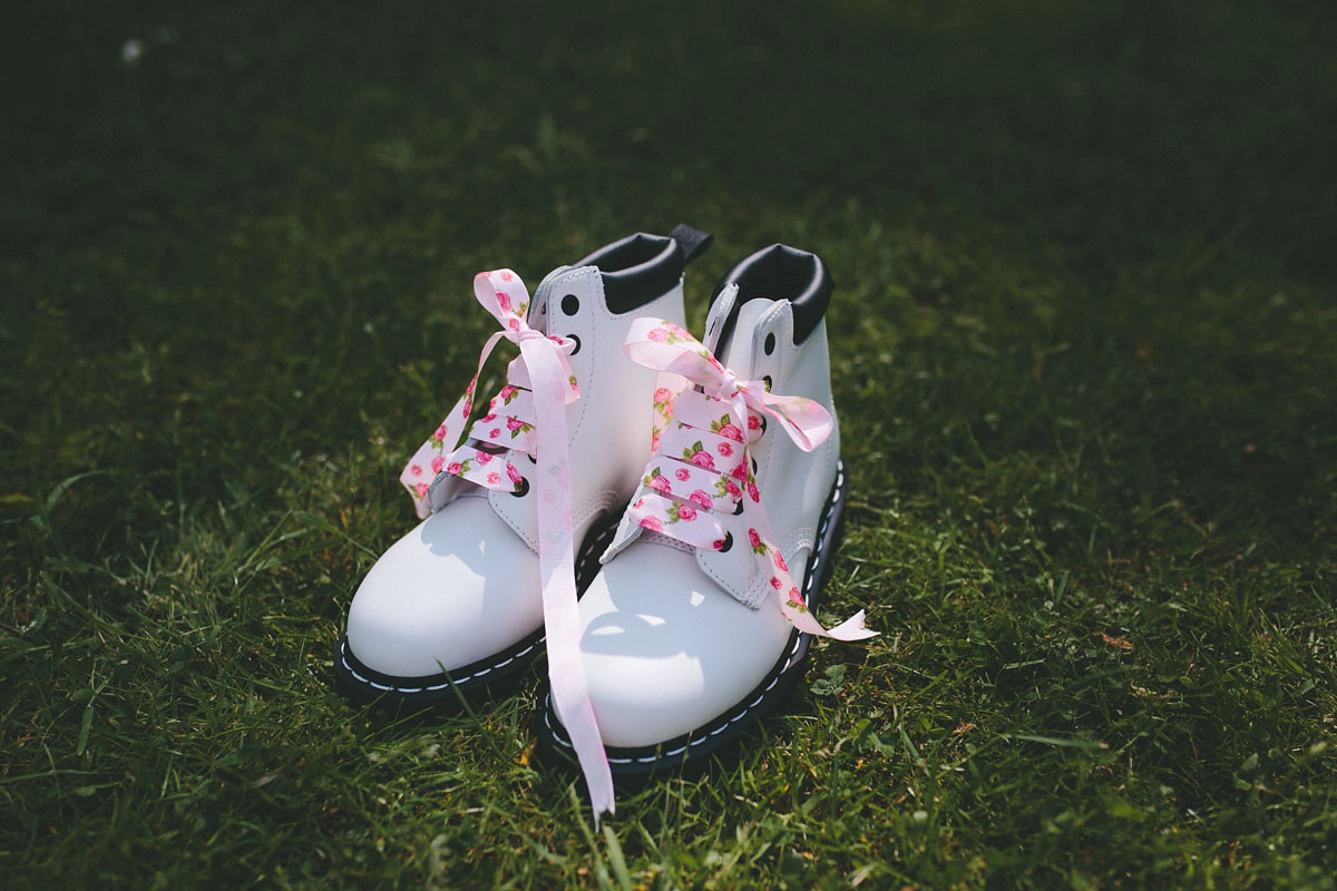 A floral wedding dress by Sassi Holford for a Summer wedding in the Peak District. Flowers by Campbell's Flowers, photography by Ellie Grace.