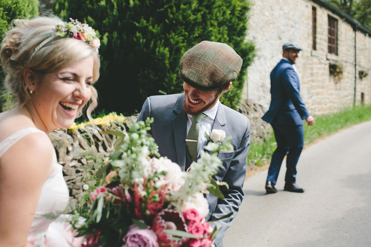 A floral wedding dress by Sassi Holford for a Summer wedding in the Peak District. Flowers by Campbell's Flowers, photography by Ellie Grace.