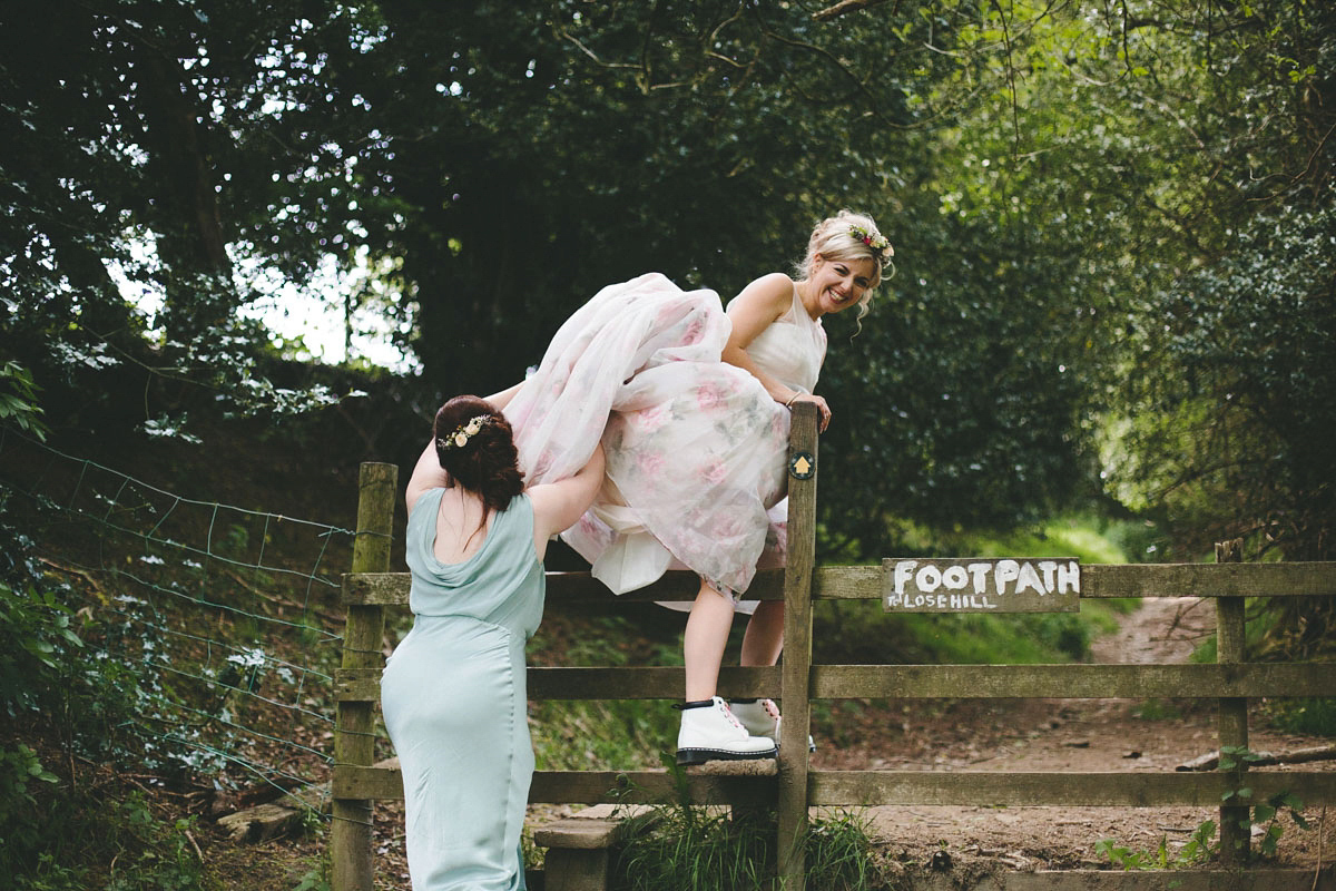 A floral wedding dress by Sassi Holford for a Summer wedding in the Peak District. Flowers by Campbell's Flowers, photography by Ellie Grace.