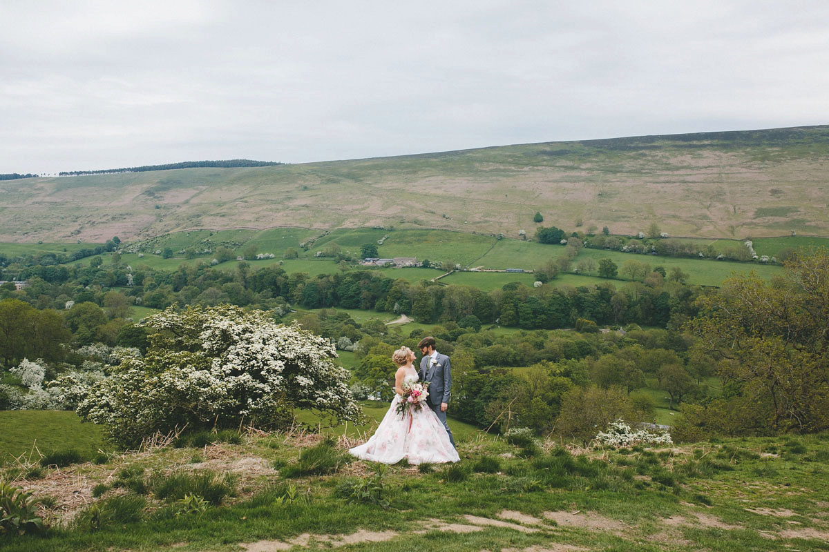 A floral wedding dress by Sassi Holford for a Summer wedding in the Peak District. Flowers by Campbell's Flowers, photography by Ellie Grace.