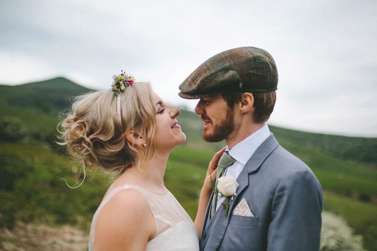 A floral wedding dress by Sassi Holford for a Summer wedding in the Peak District. Flowers by Campbell's Flowers, photography by Ellie Grace.