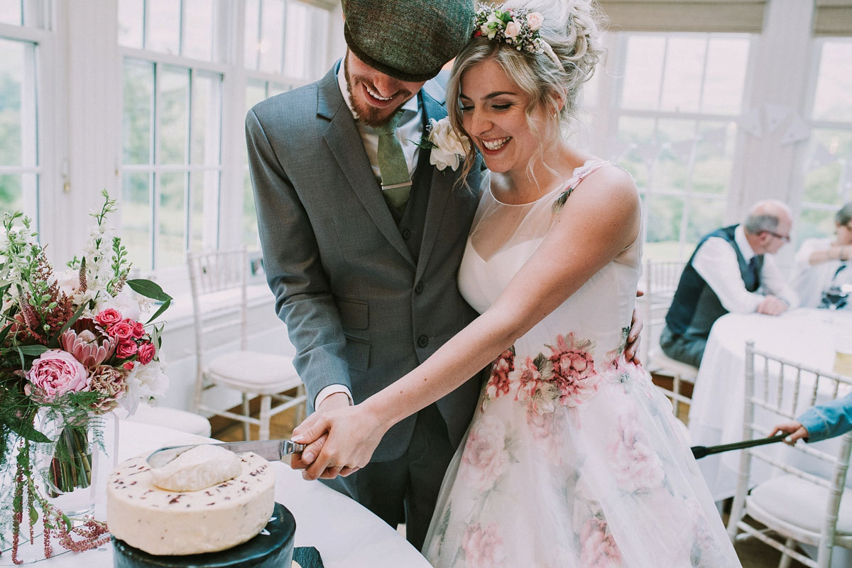 A floral wedding dress by Sassi Holford for a Summer wedding in the Peak District. Flowers by Campbell's Flowers, photography by Ellie Grace.