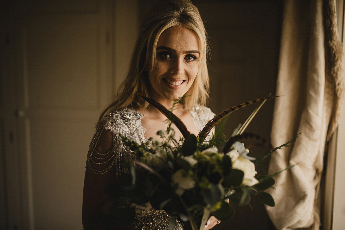 Bride Leona wears an Anna Campbell gown for her bohemian inspired wedding in Ireland. Photography by Tomasz Kornas.