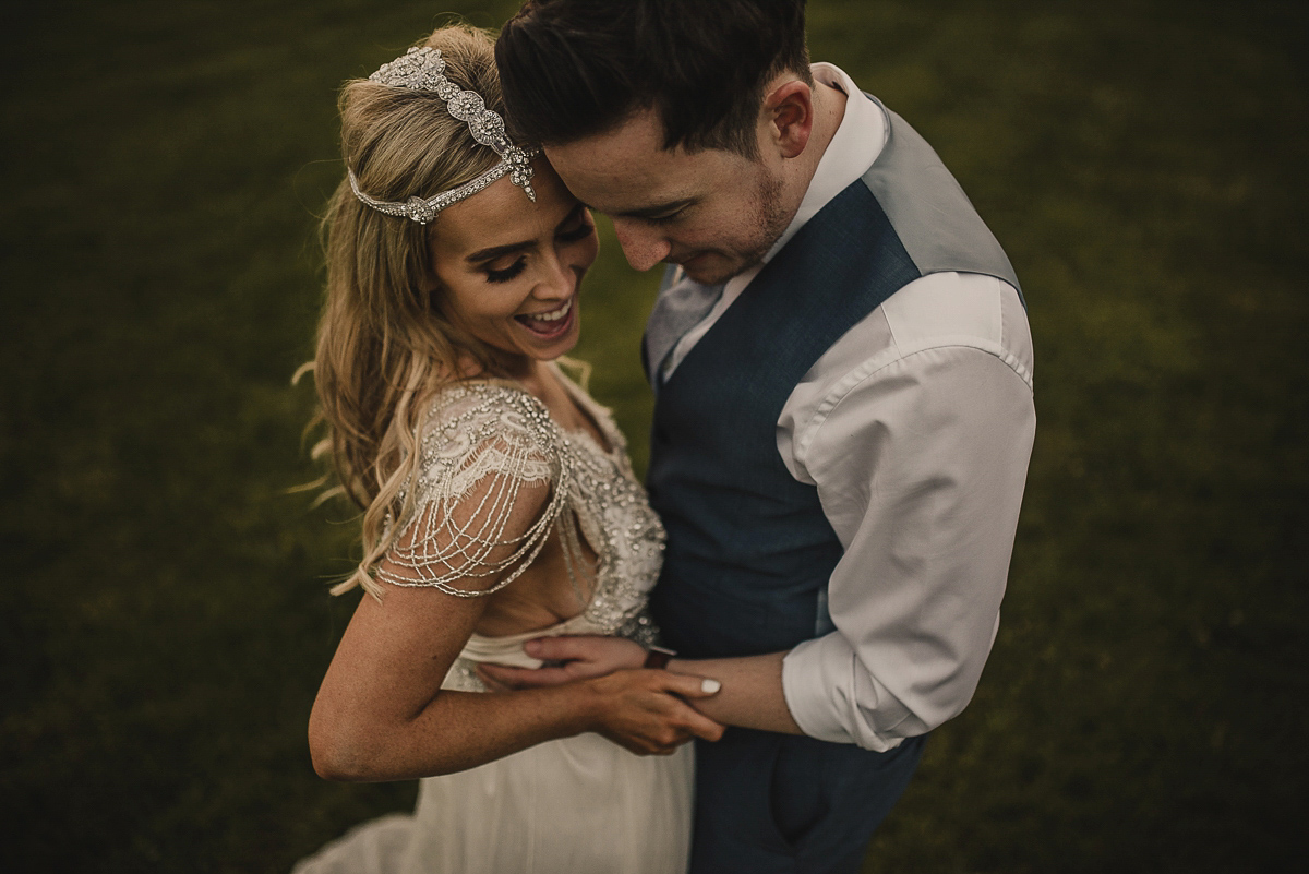 Bride Leona wears an Anna Campbell gown for her bohemian inspired wedding in Ireland. Photography by Tomasz Kornas.