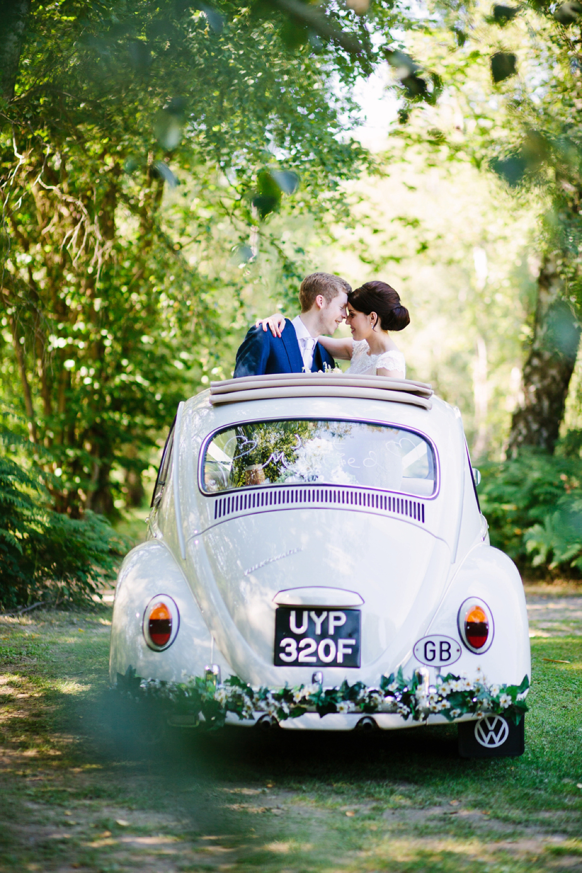 Hollie wore a Lusan Mandongus gown for her tipi wedding set in the Sussex countryside. Photography by Hayley Savage.