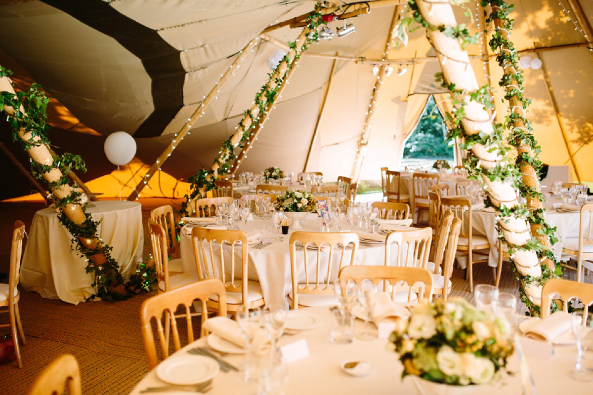 Hollie wore a Lusan Mandongus gown for her tipi wedding set in the Sussex countryside. Photography by Hayley Savage.