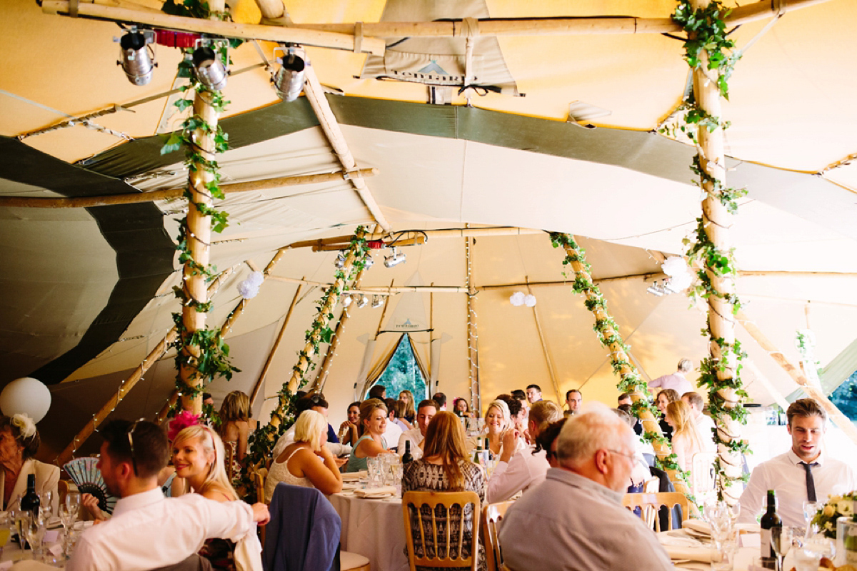 Hollie wore a Lusan Mandongus gown for her tipi wedding set in the Sussex countryside. Photography by Hayley Savage.