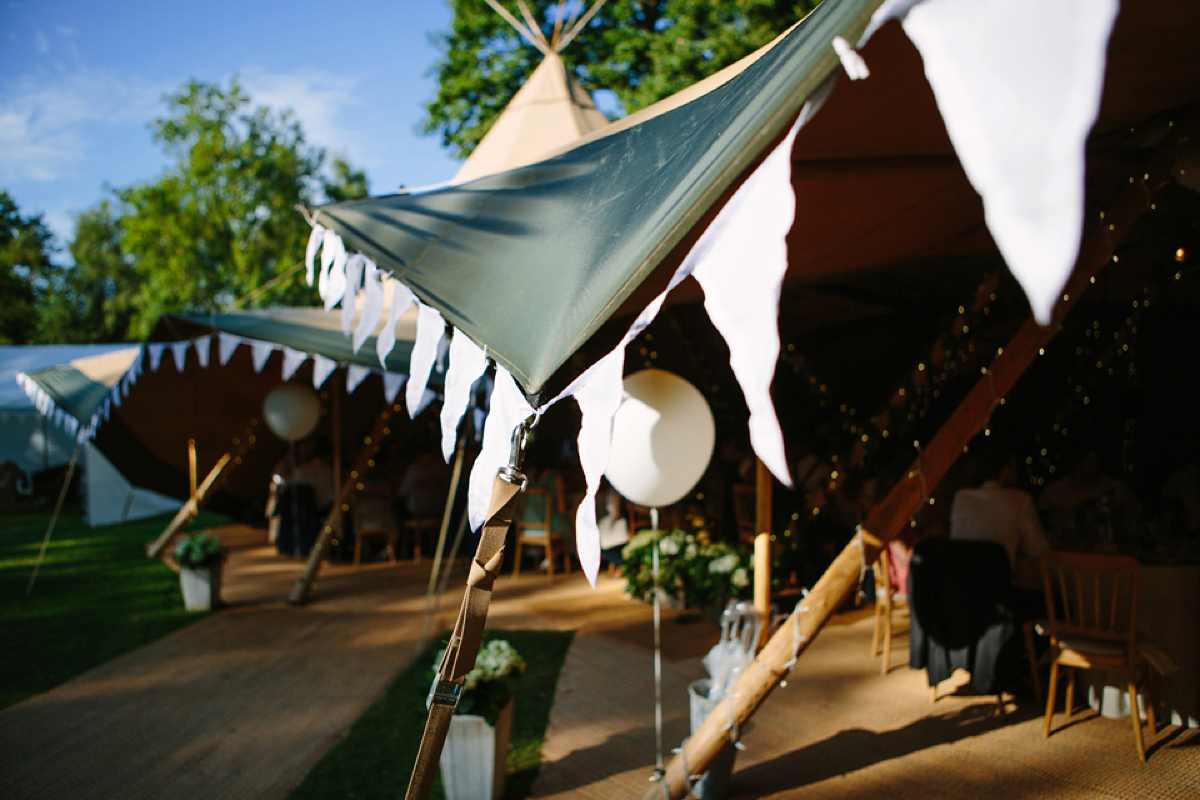 Hollie wore a Lusan Mandongus gown for her tipi wedding set in the Sussex countryside. Photography by Hayley Savage.