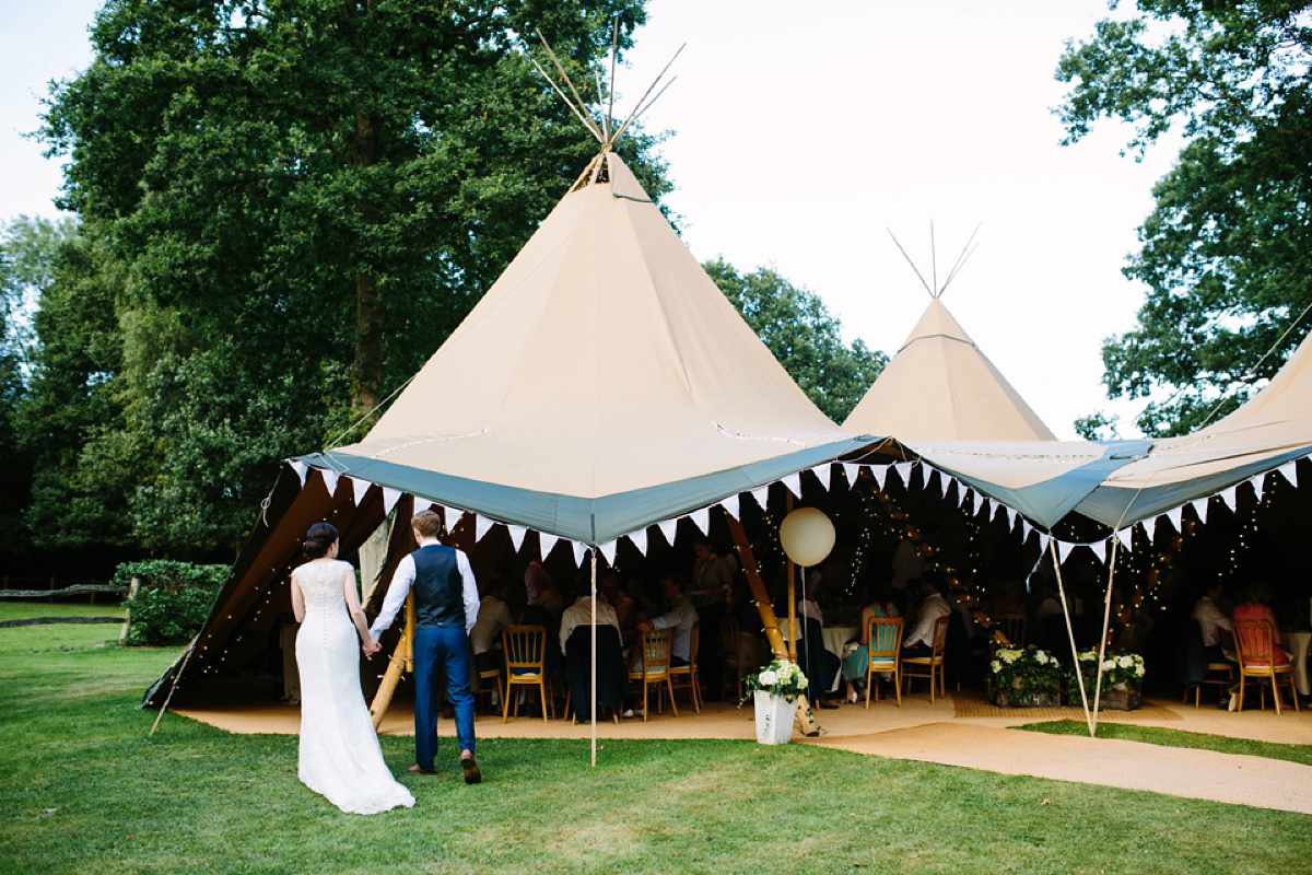 Hollie wore a Lusan Mandongus gown for her tipi wedding set in the Sussex countryside. Photography by Hayley Savage.