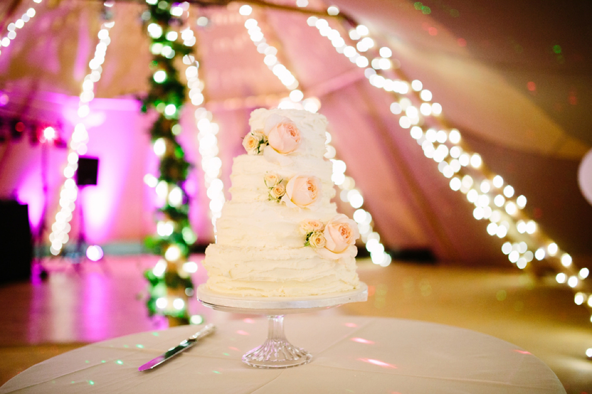 Hollie wore a Lusan Mandongus gown for her tipi wedding set in the Sussex countryside. Photography by Hayley Savage.