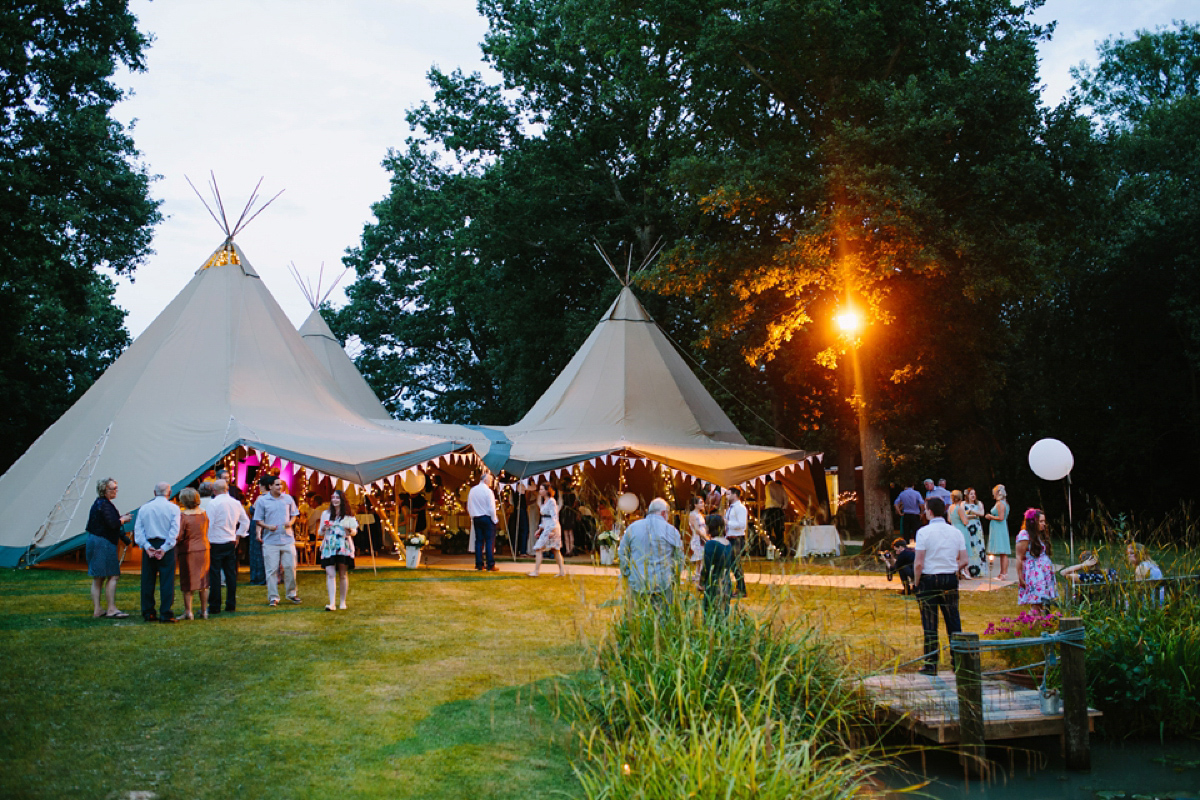 Hollie wore a Lusan Mandongus gown for her tipi wedding set in the Sussex countryside. Photography by Hayley Savage.