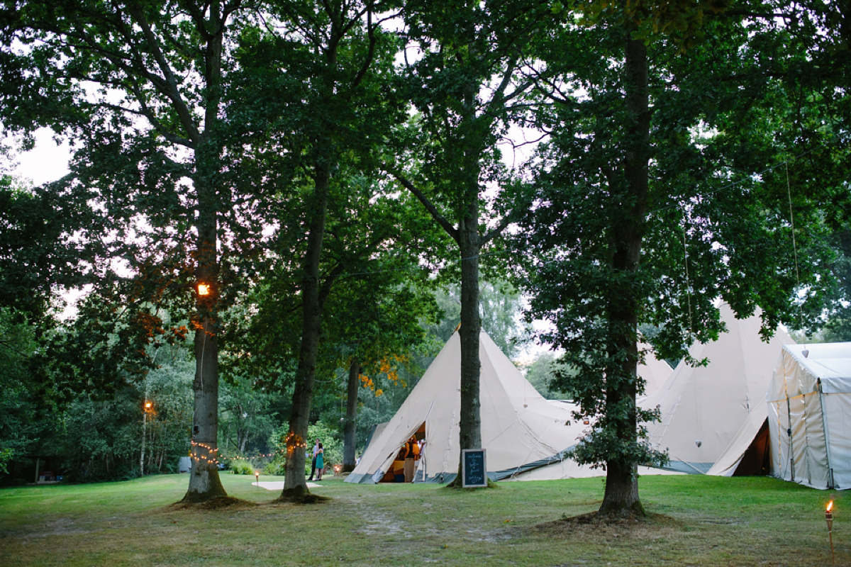 Hollie wore a Lusan Mandongus gown for her tipi wedding set in the Sussex countryside. Photography by Hayley Savage.