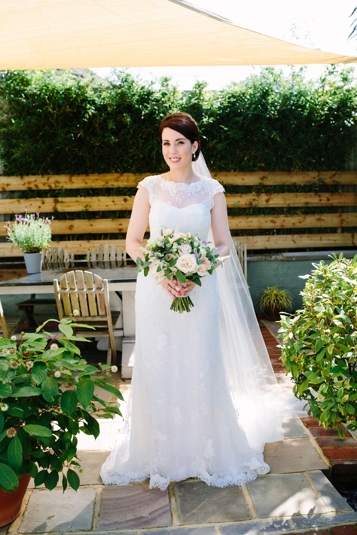 Hollie wore a Lusan Mandongus gown for her tipi wedding set in the Sussex countryside. Photography by Hayley Savage.