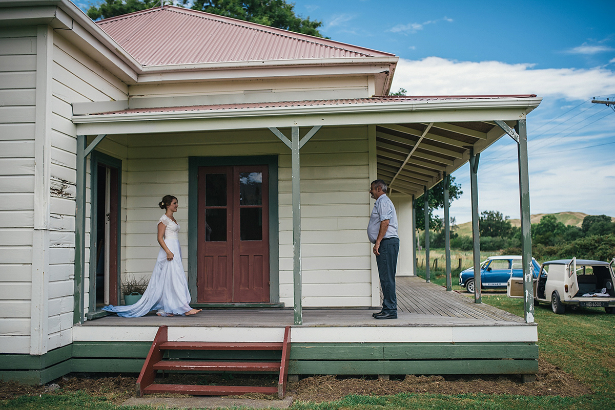 Suzy wore a stunning ombre/dip dye dress for her barefoot beach wedding in New Zealand. Photography by Meredith Lord.