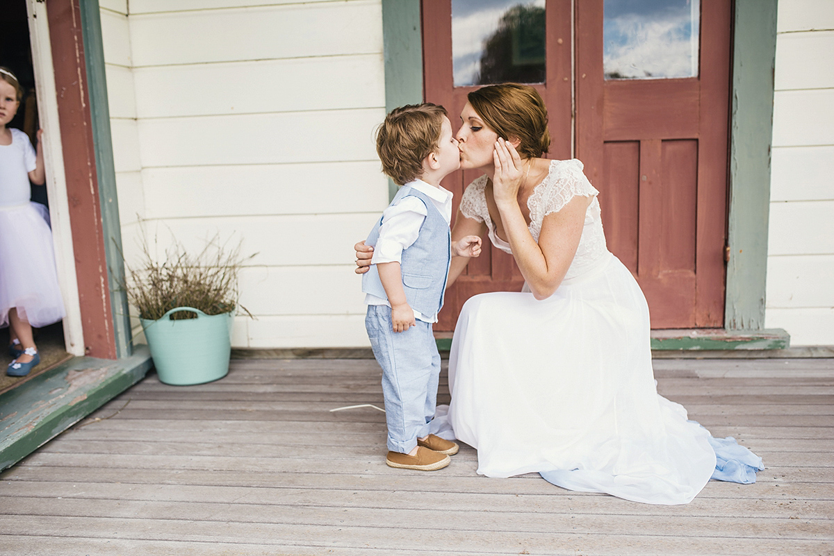 Suzy wore a stunning ombre/dip dye dress for her barefoot beach wedding in New Zealand. Photography by Meredith Lord.