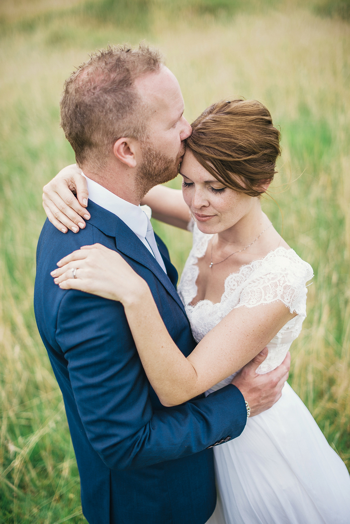 Suzy wore a stunning ombre/dip dye dress for her barefoot beach wedding in New Zealand. Photography by Meredith Lord.