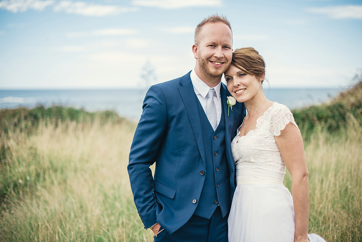 Suzy wore a stunning ombre/dip dye dress for her barefoot beach wedding in New Zealand. Photography by Meredith Lord.