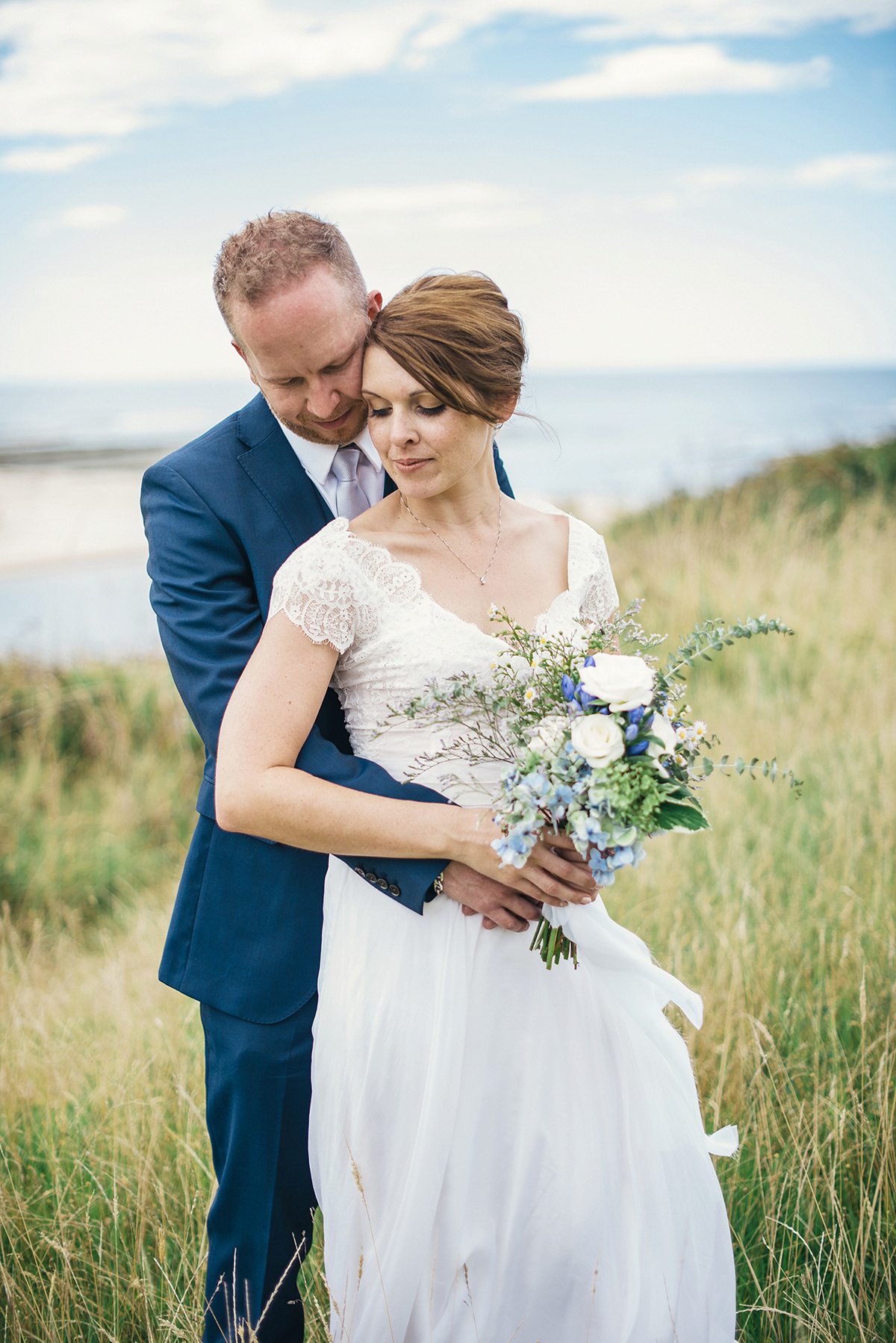 Suzy wore a stunning ombre/dip dye dress for her barefoot beach wedding in New Zealand. Photography by Meredith Lord.