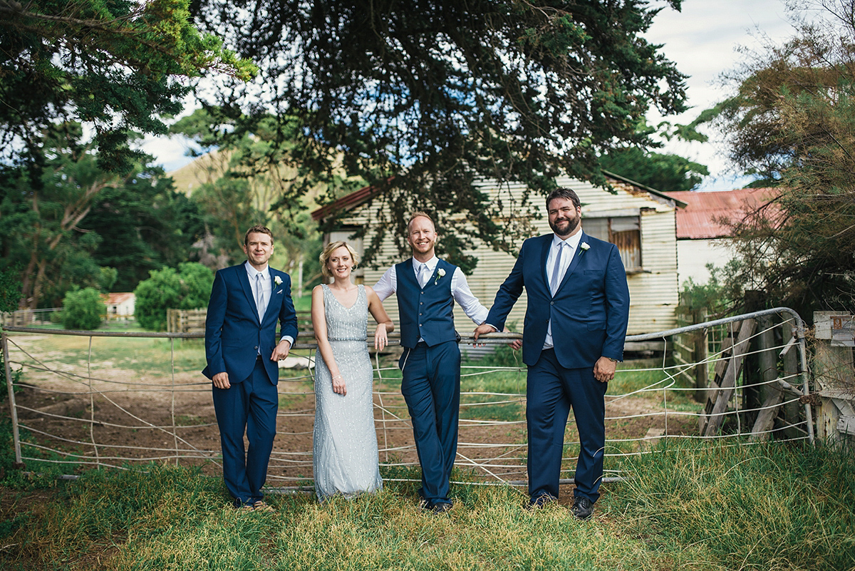 Suzy wore a stunning ombre/dip dye dress for her barefoot beach wedding in New Zealand. Photography by Meredith Lord.