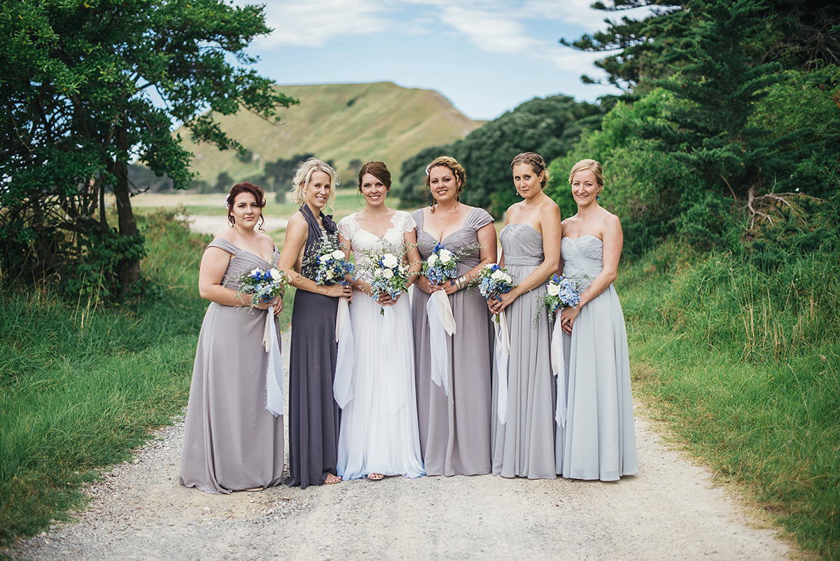 Suzy wore a stunning ombre/dip dye dress for her barefoot beach wedding in New Zealand. Photography by Meredith Lord.