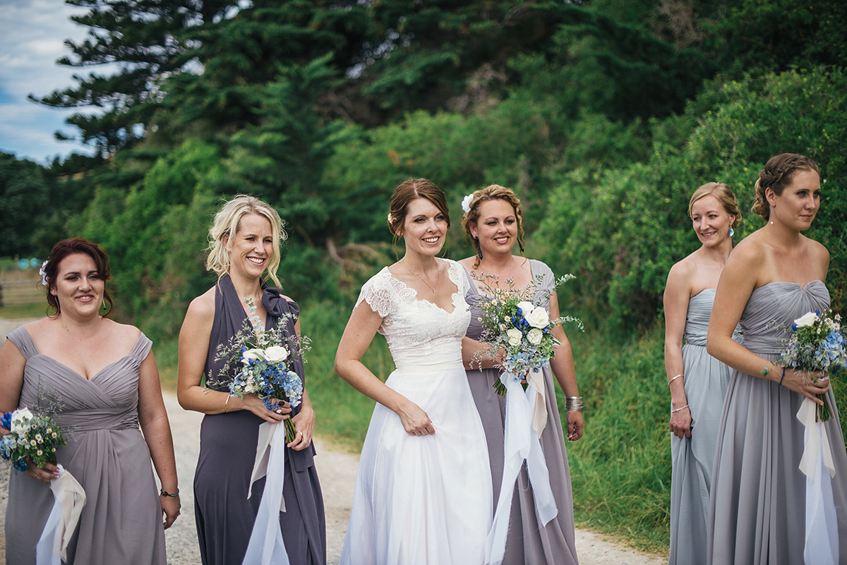 Suzy wore a stunning ombre/dip dye dress for her barefoot beach wedding in New Zealand. Photography by Meredith Lord.